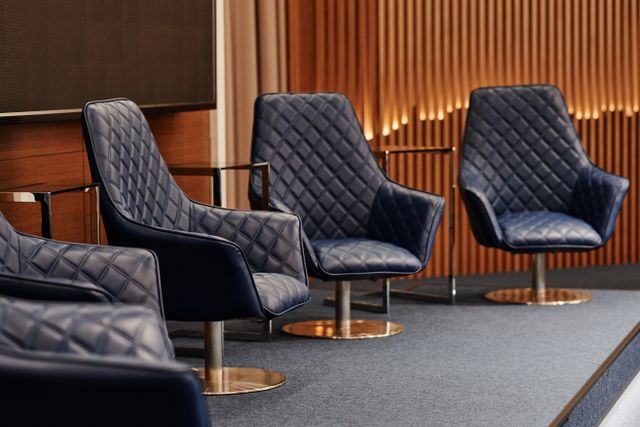 Row of seats lined up for a board of directors.