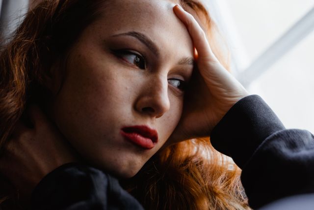 Woman in thought about her stuck patterns of behavior.